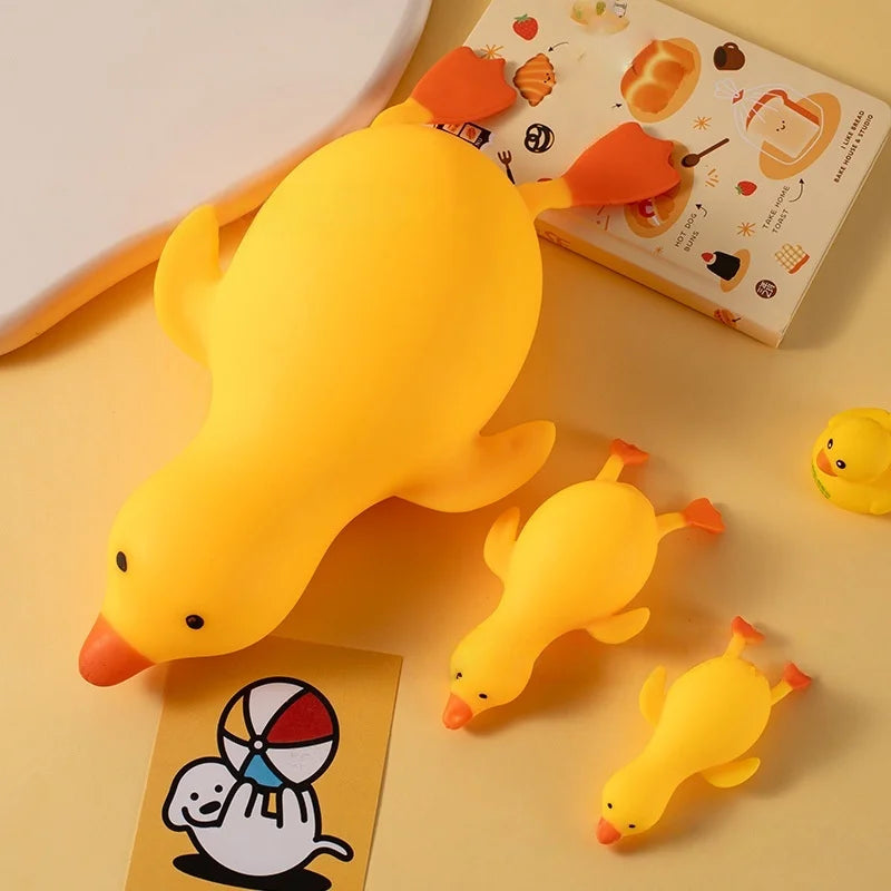 Three yellow squishy ducks