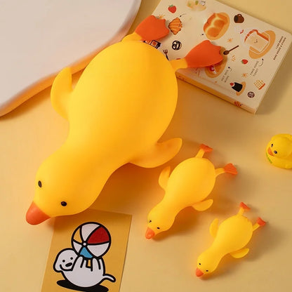Three yellow squishy ducks